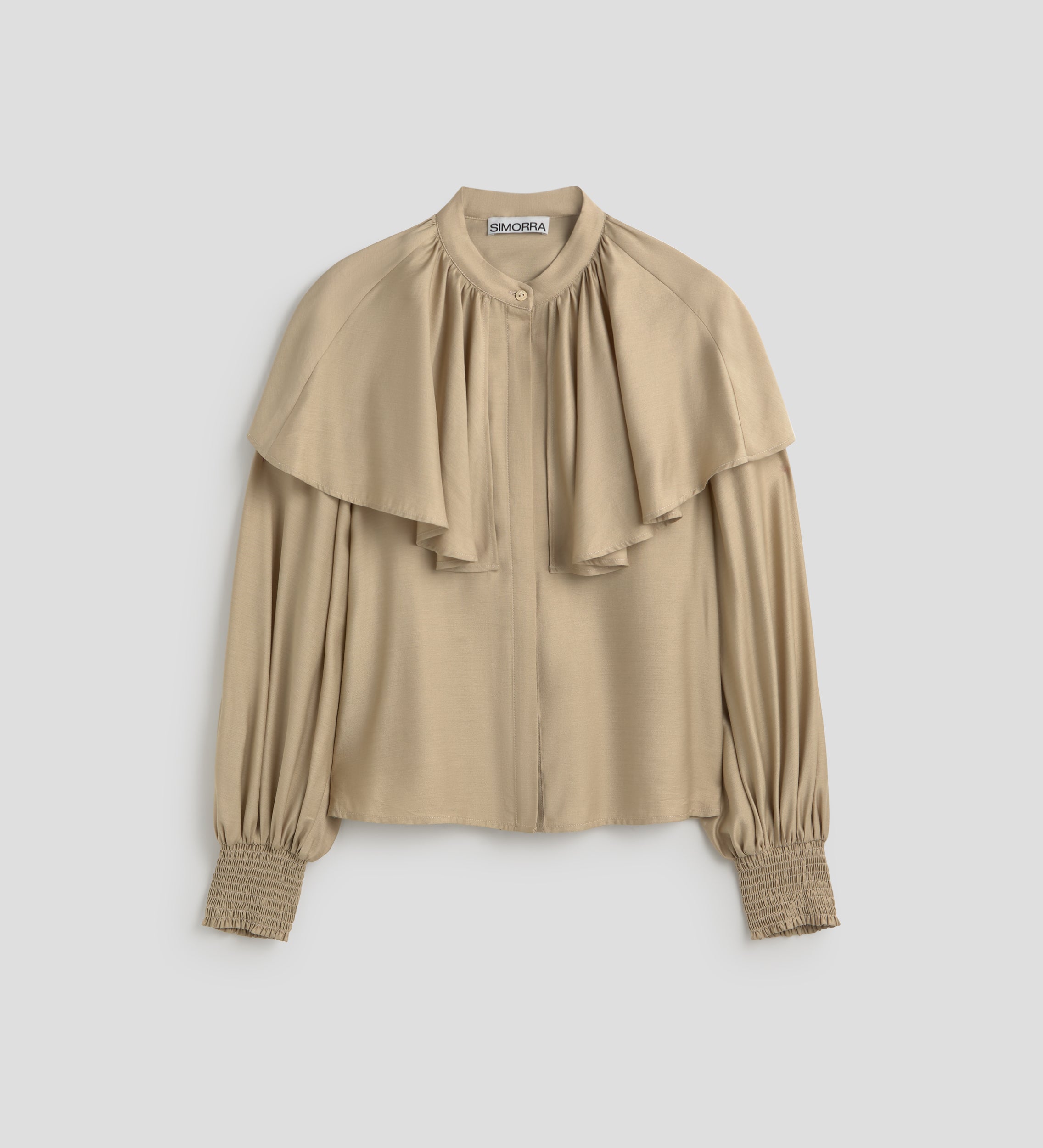 Blusa capa manga abullonada